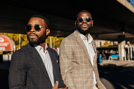 Confident businessmen in suit walking on the street