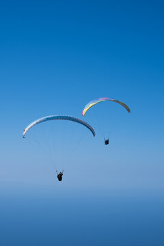 two paraglider in the blue sky