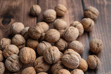 Whole walnuts on a wooden table