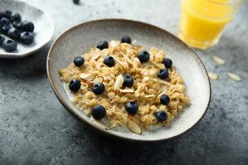 Homemade oatmeal porridge with blueberry and almond flakes