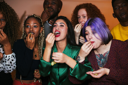 Friends making wish at midnight