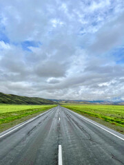 The road goes into the distance in the mountains, a part of the Chuisky tract , Altai, Russia