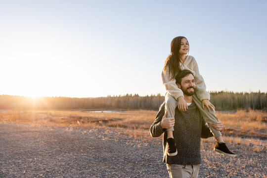 Daughter On Fathers Shoulders