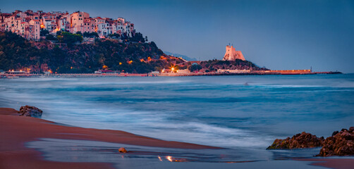 Spectacular summer cityscape of Sperlonga town with Truglia Tower. Majestic morning seascape of...