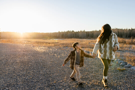 Woman Walks With Her Son