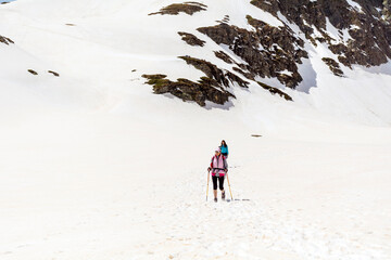 Fototapeta na wymiar People Hiking in the High Snowy Mountain .Winter Vacation in Bulgaria ,Seven Rila Lakes 