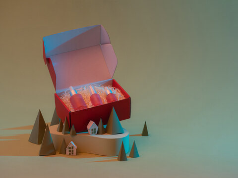 Containers of different sizes for cosmetics on a green background. Christmas composition with cosmetics.