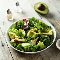 Healthy green salad with artichoke and avocado