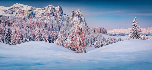 Panoramic morning view of Alpe di Siusi village. Colorful winter sunrise in Dolomite Alps....