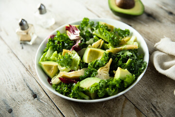 Healthy green salad with artichoke and avocado