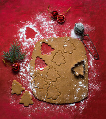 Christmas cookies on red background, cocoa, christmas tree and christmas 
 toys. Trend photo in two planes