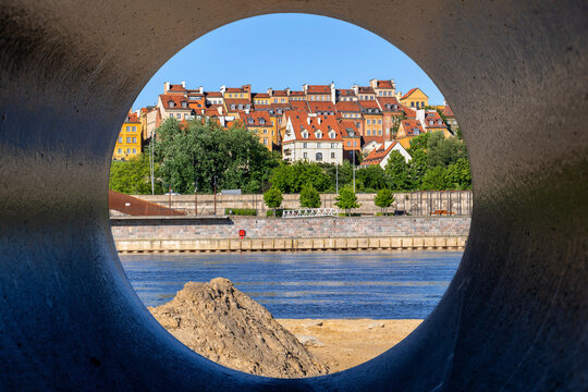 Poland, Masovian Voivodeship, Warsaw, Old town houses seen through riverside pipe