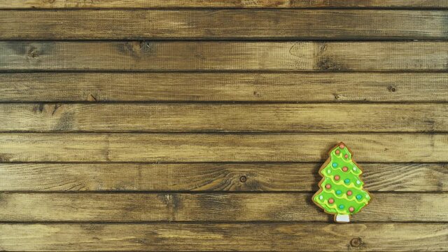 Gingerbread cookies on wooden background. Christmas pattern with place for text.
