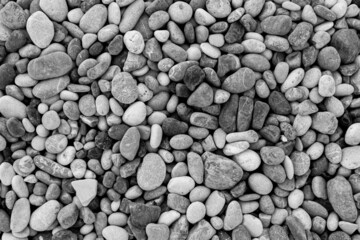 black and white stones pebbles on the sea beach