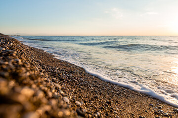 beautiful shiny pebbles on the seashore