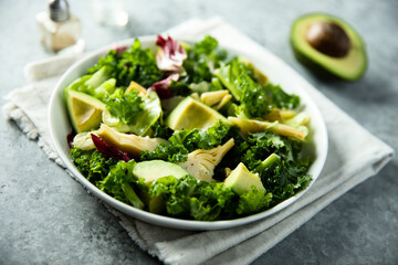 Healthy green salad with artichoke and avocado