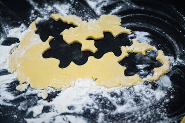 Cookies are cut from the dough