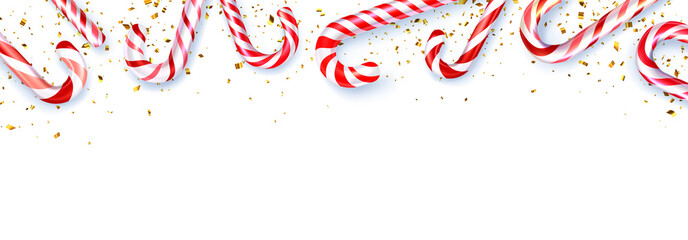 Red and white striped candy cane sticks frame on white background.