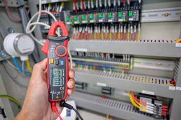 Electrical measurements with a multimeter tester industrial electricity Test the voltage on the...