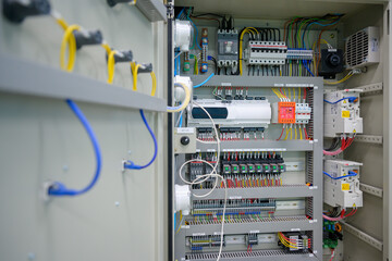 Close-up shot of an industrial electric automatic electrical control box that supplies the power line in an electrical control cabinet. electric background selective focus