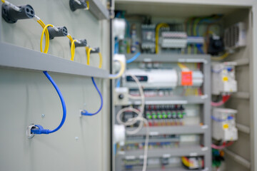 Close-up shot of an industrial electric automatic electrical control box that supplies the power line in an electrical control cabinet. electric background selective focus