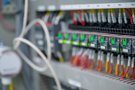 Close-up shot of an industrial electric automatic electrical control box that supplies the power line in an electrical control cabinet. electric background selective focus