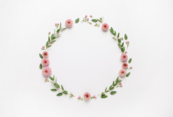 Beautiful wreath made of flowers and eucalyptus on white background, flat lay