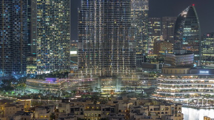 Dubai Downtown night timelapse with tallest skyscraper and other towers