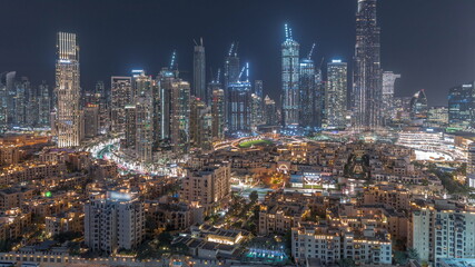 Fototapeta na wymiar Dubai Downtown night timelapse with tallest skyscraper and other towers