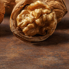 Walnuts on dark  wooden  table. Walnuts kernels  nuts with Copyspace.
