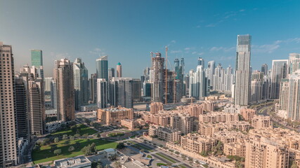 Dubai's business bay towers aerial morning timelapse. Rooftop view of some skyscrapers