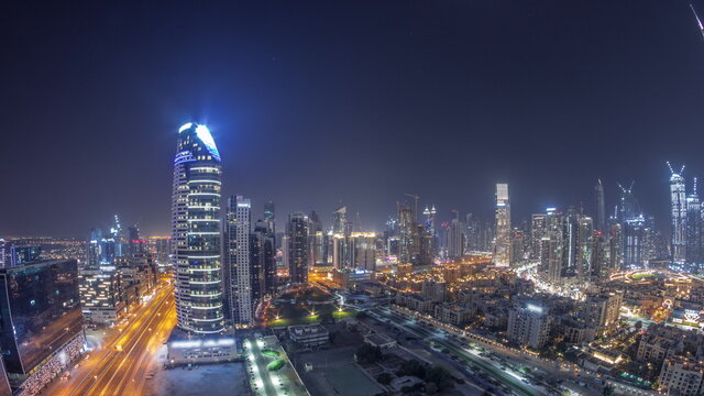 Dubai's Business Bay Towers Aerial All Night Timelapse. Rooftop View Of Some Skyscrapers