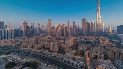 Fototapeta na wymiar Dubai Downtown morning timelapse with tallest skyscraper and other towers