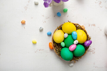 Overhead view of easter color eggs in nest