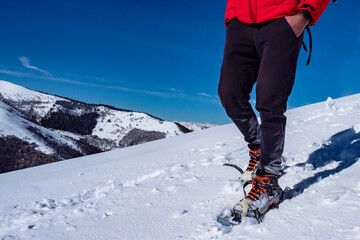 Fototapeta na wymiar Snowshoeing scene in the italian alps