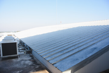 metal sheet roofing on commercial construction with blue sky	