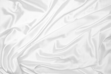Creases of white satin, silk, and cotton. Abstract white fabric texture background.
