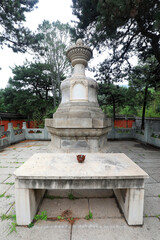Fototapeta premium architectural landscape of covered bowl tombs in the park, Beijing