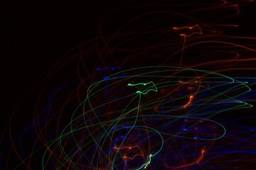 Multicolored neon lights on black background