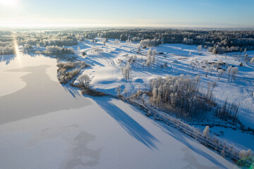 Obraz premium Aerial winter sunny frozen morning view of nature landscape