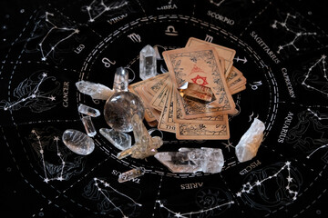 quartz minerals, crystal ball, vintage Tarot card on black divination napkin. divination of...