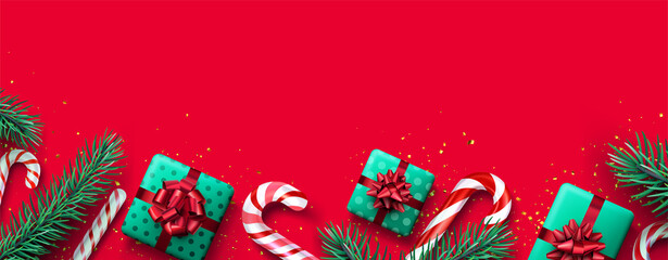 Red and white striped candy cane sticks with fir branches border.