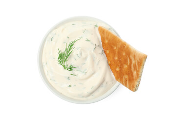 Tasty creamy dill sauce with cracker in bowl isolated on white, top view