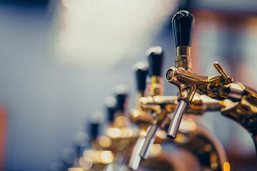 Metallic beer pump close up at a pub
