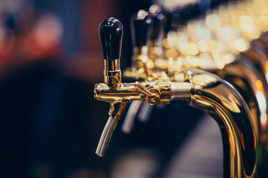 Metallic beer pump close up at a pub