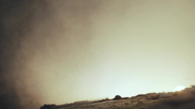 Macro view of Soviet tank. T34 emerging from behind the hill