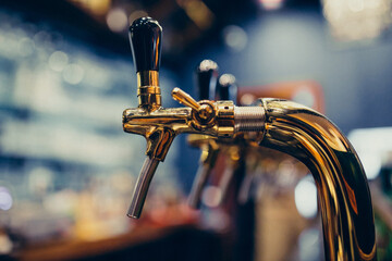 Metallic beer pump close up at a pub
