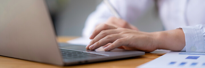 Business woman accountant working audit and calculating expense financial annual financial report balance sheet statement, doing finance making notes on paper checking document.