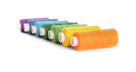 Set of colorful sewing threads on white background