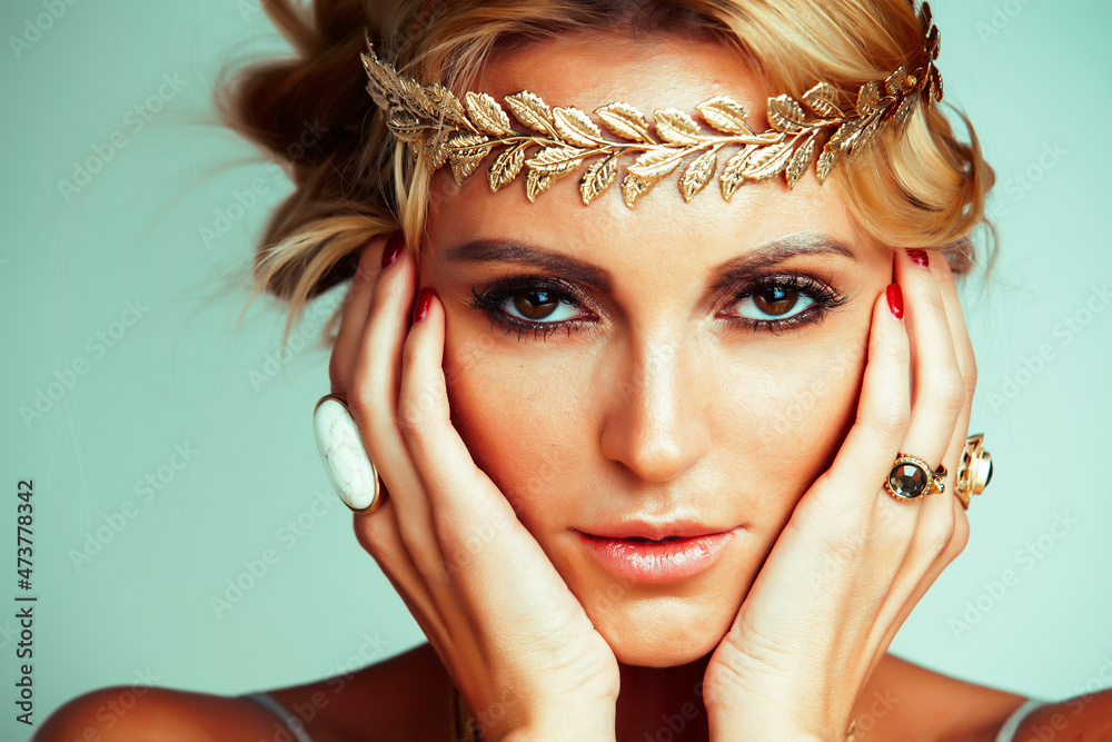 Canvas Prints young blond woman dressed like ancient greek godess, gold jewelry close up isolated, beautiful girl 